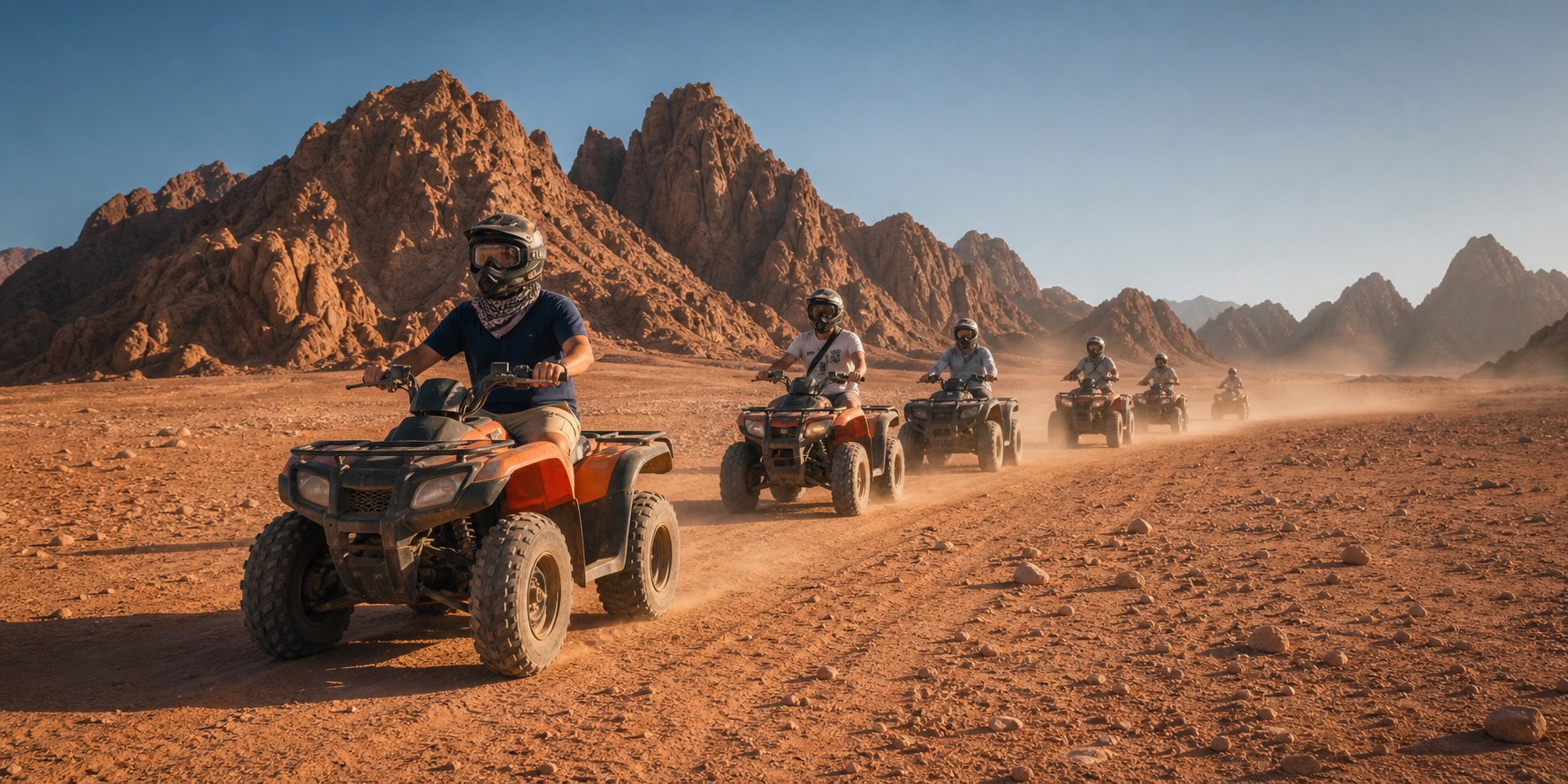 A local guide leading travelers on a quad-bike safari through the desert